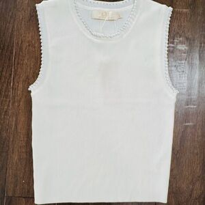 Elegant Off White Sleeveless Top with pearl accents.